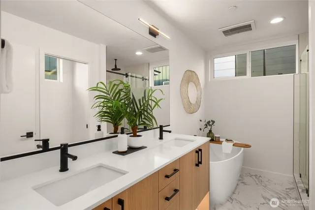 a bathroom with a double vanity sink and a mirror