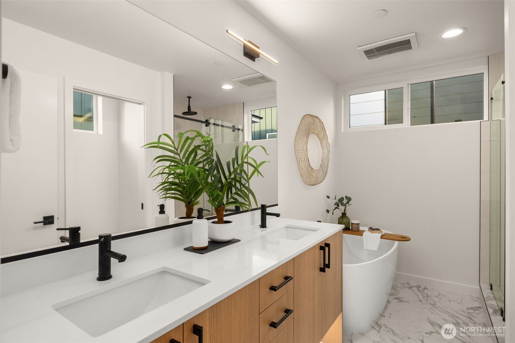 914 A 15th Avenue Seattle, WA 98122 - Photo 4 of 35 a bathroom with a double vanity sink and a mirror