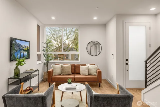 a living room with furniture and a large window