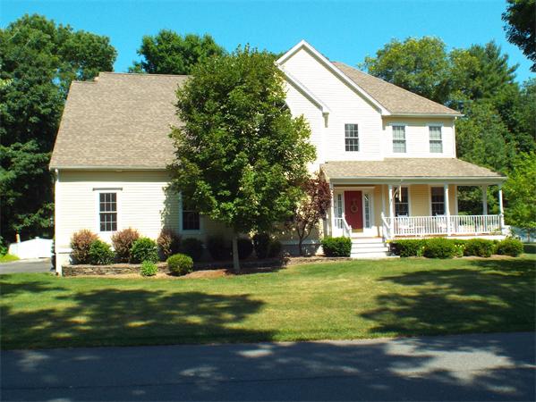 34 Marcus Road Sharon, MA 02067 - Photo 1 of 6 a view of a white house with a big yard and potted plants and large trees