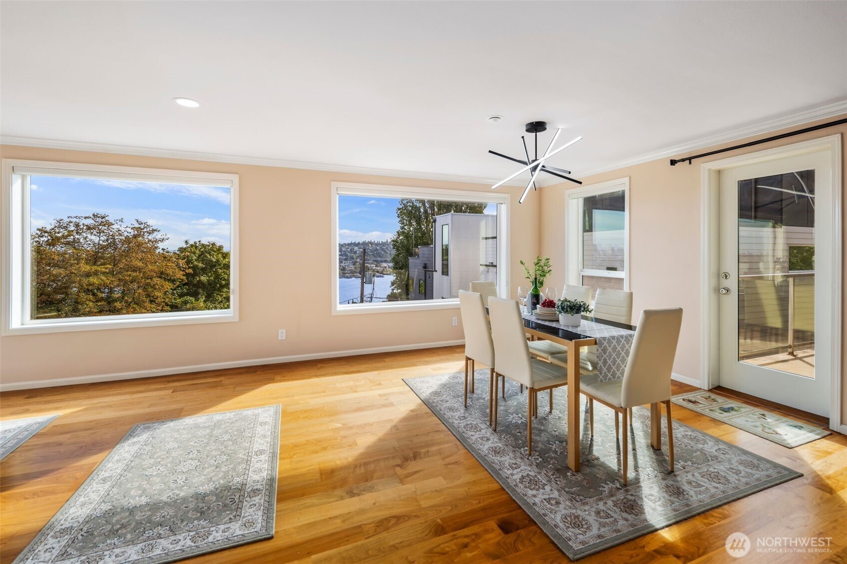 559 McGraw Street, Unit 402 Seattle, WA 98109 - Photo 11 of 39 a dining room with wooden floor and large window