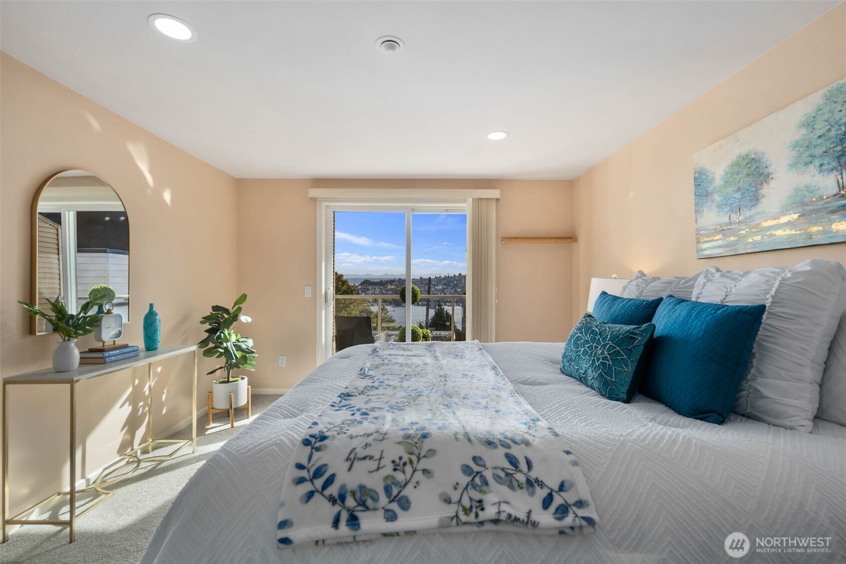 559 McGraw Street, Unit 402 Seattle, WA 98109 - Photo 19 of 39 a large bedroom with a bed and a large window