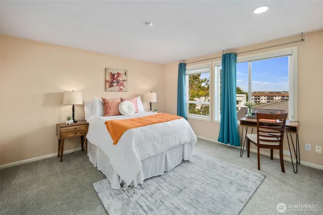 a bed room with a bed and a chair