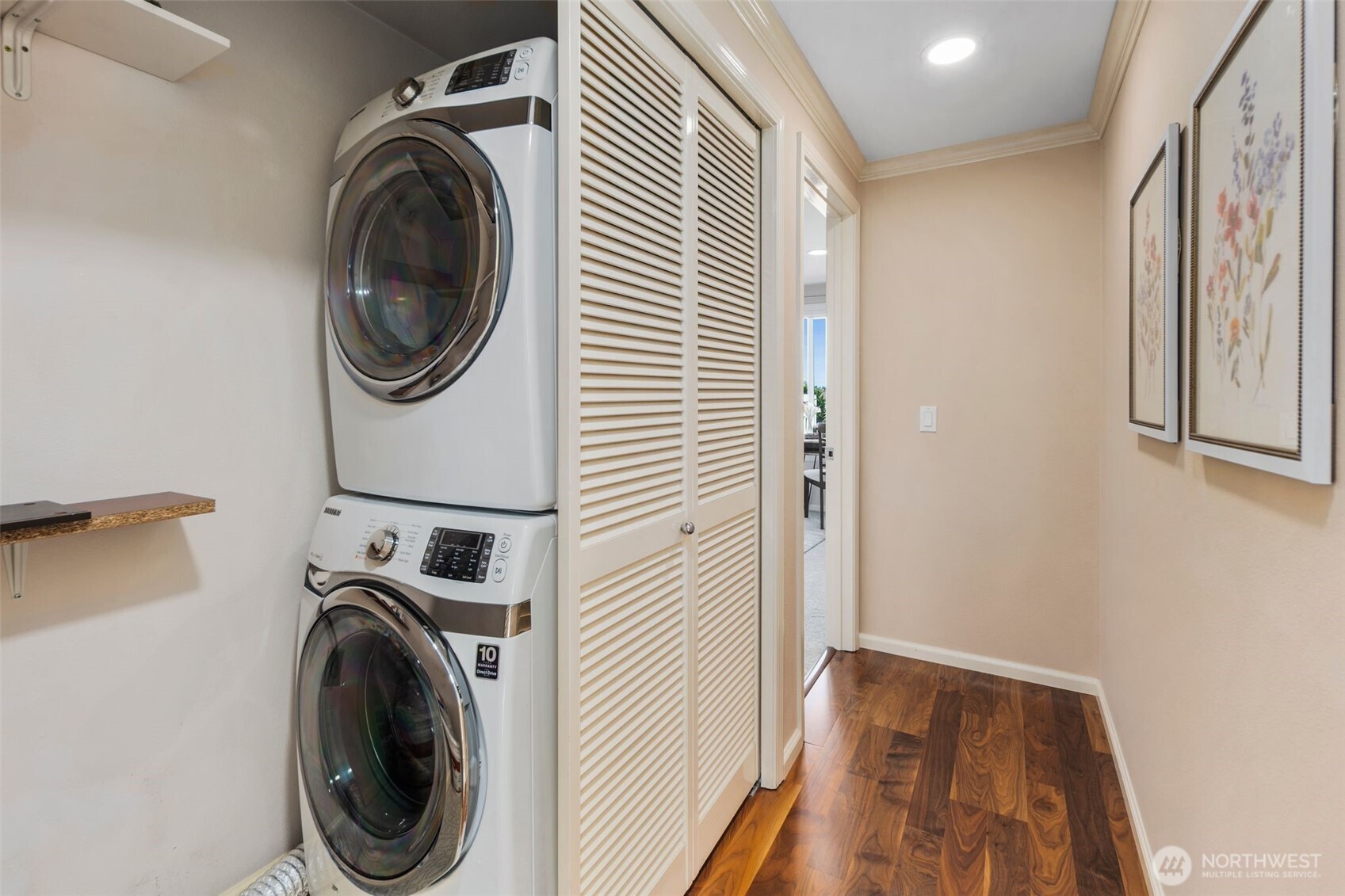 559 McGraw Street, Unit 402 Seattle, WA 98109 - Photo 27 of 39 a view of a hallway with washer and dryer
