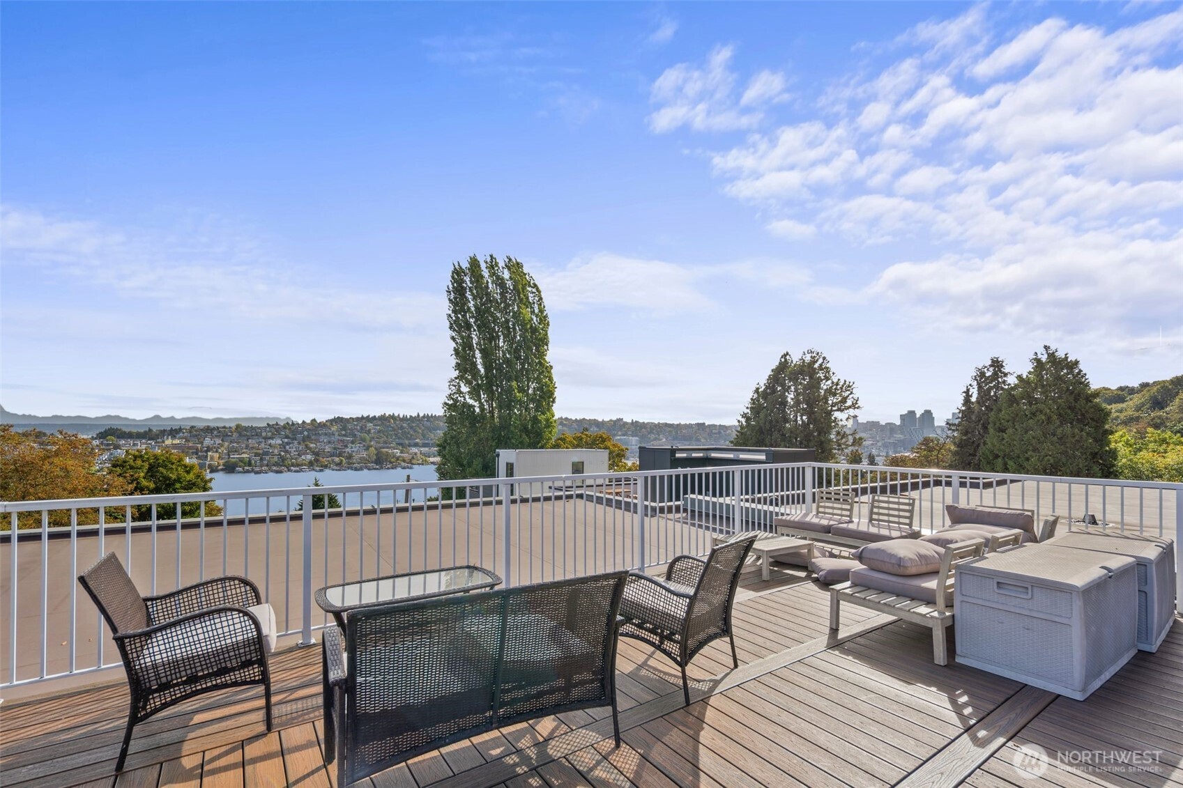 559 McGraw Street, Unit 402 Seattle, WA 98109 - Photo 30 of 39 a view of roof deck with couches and city view