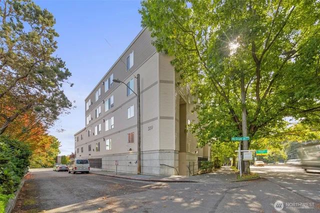 a view of a street with a building in the background