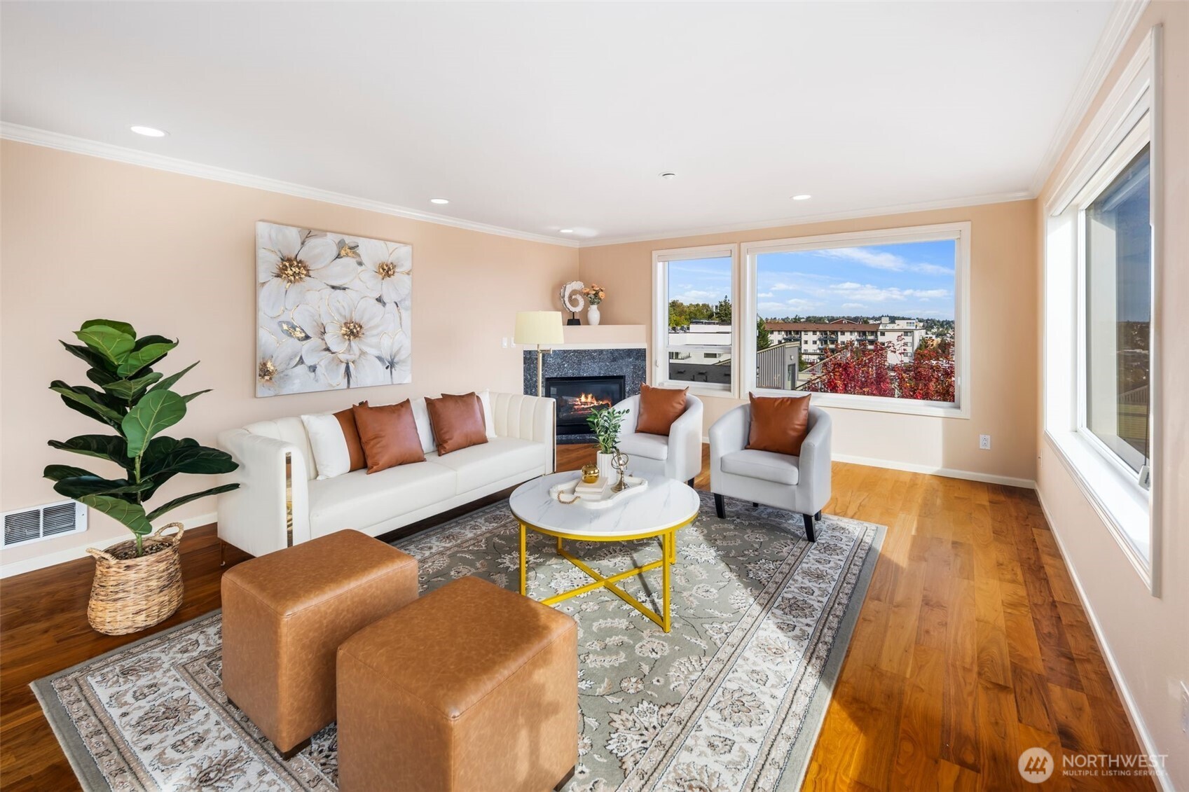 559 McGraw Street, Unit 402 Seattle, WA 98109 - Photo 5 of 39 a living room with furniture and a dining table with wooden floor