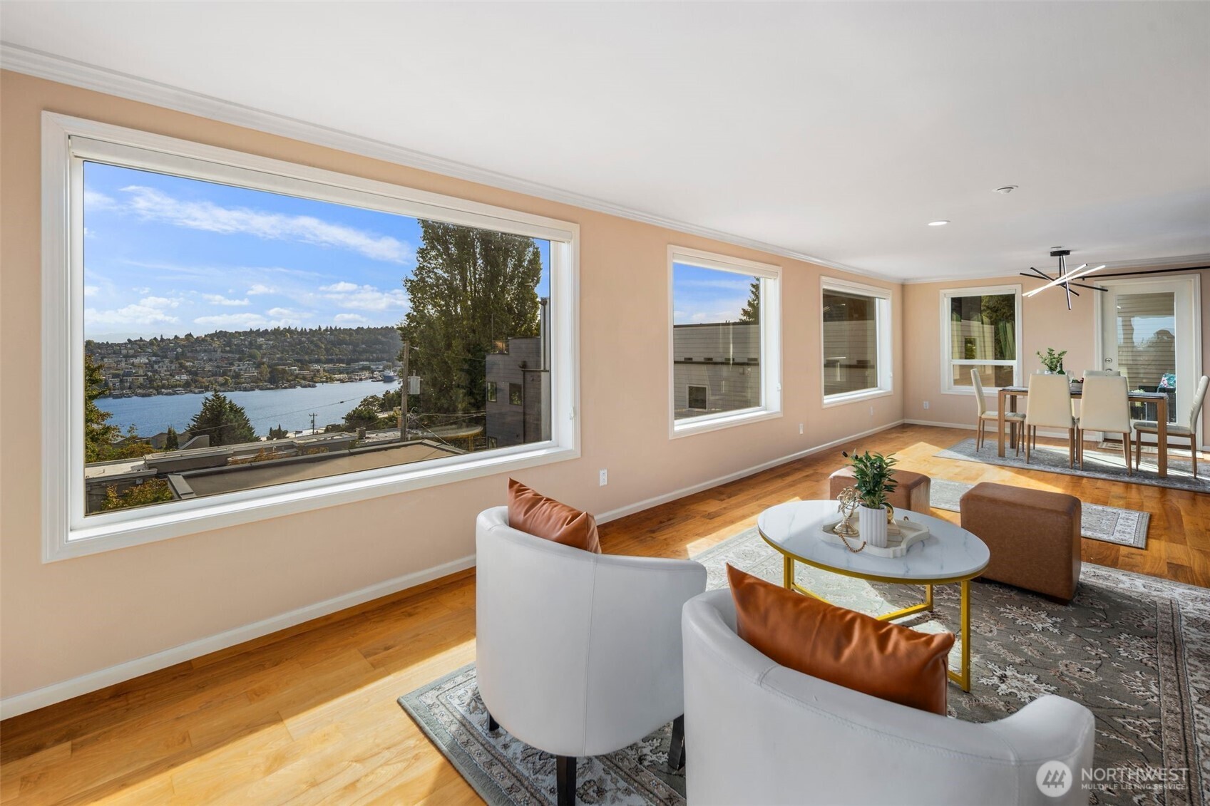 559 McGraw Street, Unit 402 Seattle, WA 98109 - Photo 6 of 39 a living room with furniture and a large window