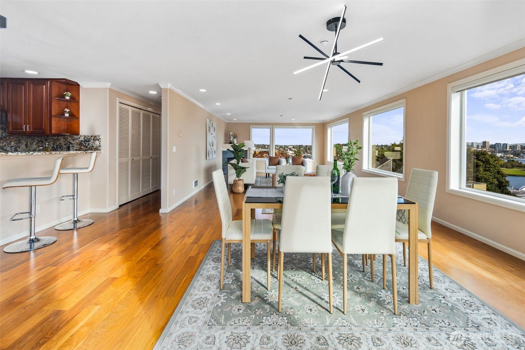 559 McGraw Street, Unit 402 Seattle, WA 98109 - Photo 8 of 39 a view of a dining room with furniture window and wooden floor