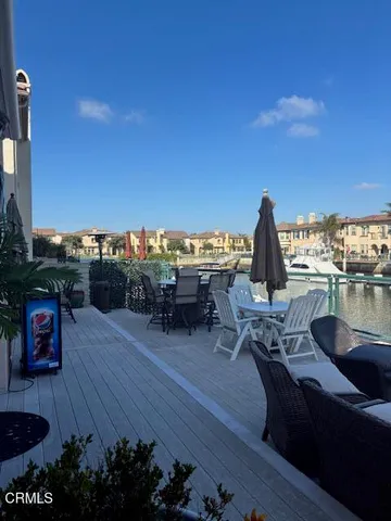 a view of a terrace with furniture and a table