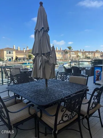 a view of a terrace with furniture and stove