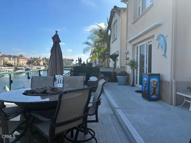 a view of an outside dining space with furniture