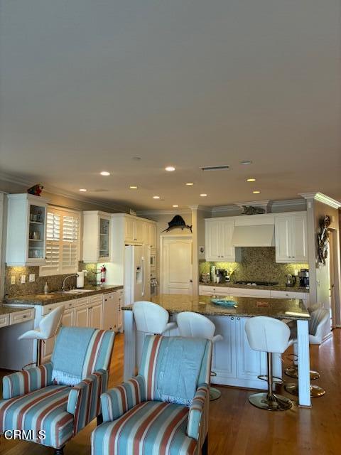 1470 Viewpoint Drive Oxnard, CA 93035 - Photo 3 of 23 a kitchen with kitchen island granite countertop wooden floors and chairs