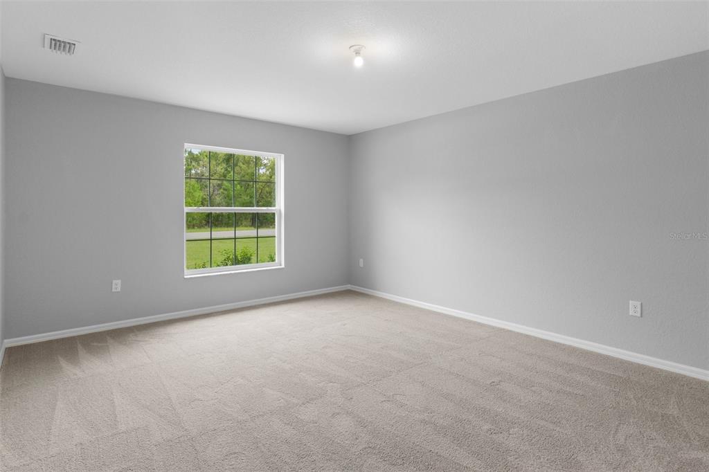 16375 Kakawi Road Brooksville, FL 34614 - Photo 13 of 30 an empty room with a window
