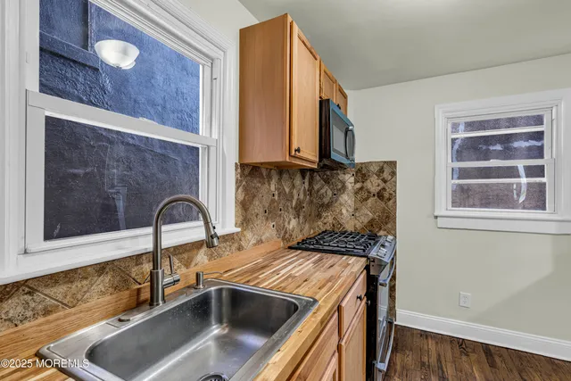 a kitchen with a sink and a window