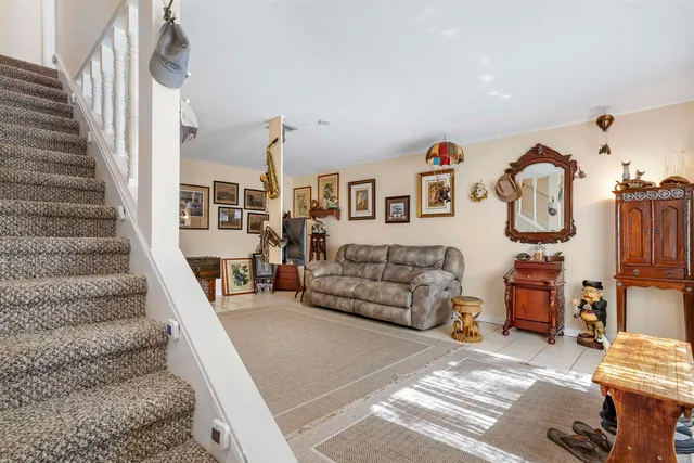 a bedroom with furniture and a wooden floor