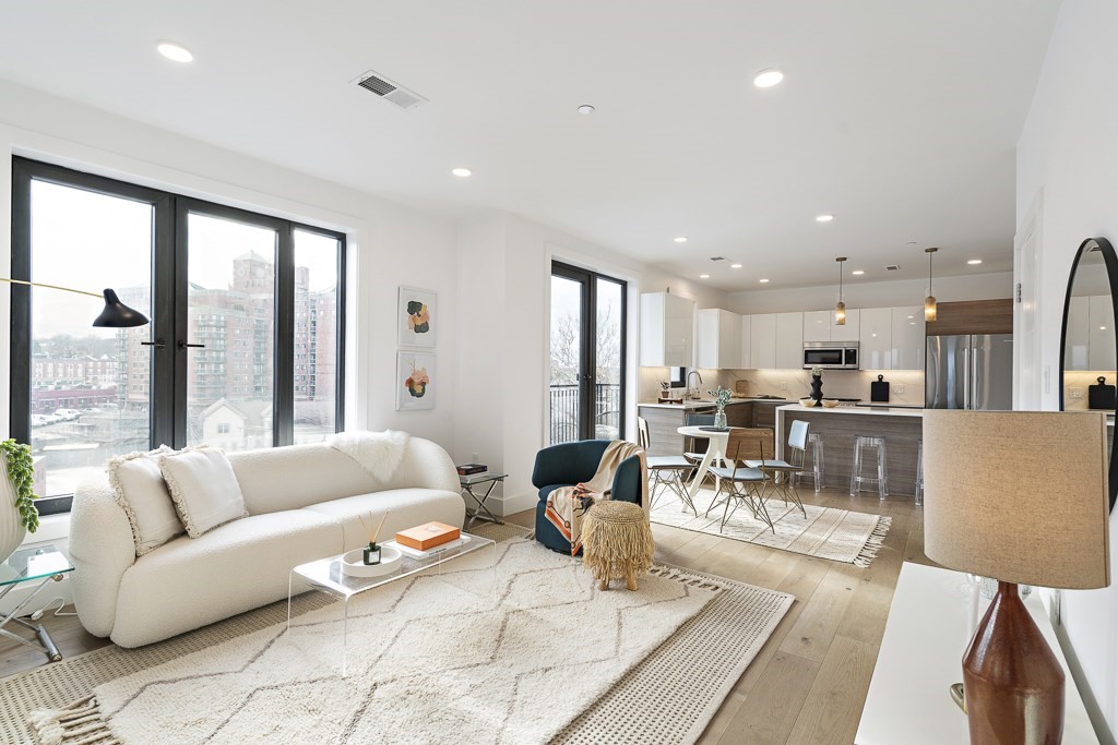 30 Penniman Road, Unit 507 Boston, MA 02134 - Photo 3 of 5 a living room with furniture and a large window