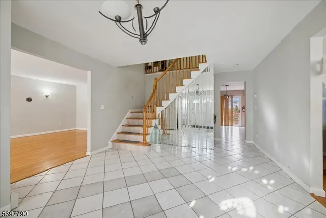 a view of entryway and hall with a dining table