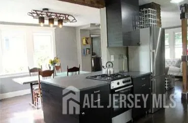 a view of a dining room with furniture and window