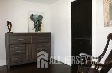 a bedroom with a bed and chair