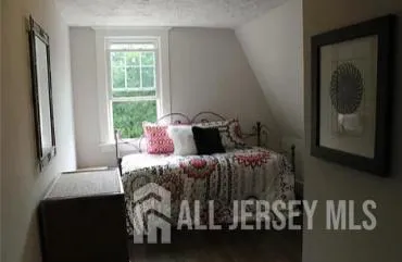 a bathroom with a toilet a sink and a mirror