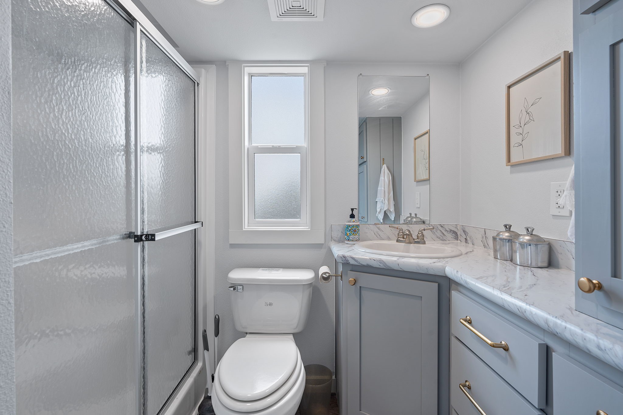 635 Ivean Pearson Road Lago Vista, TX 78645 - Photo 13 of 24 a bathroom with a toilet sink and mirror