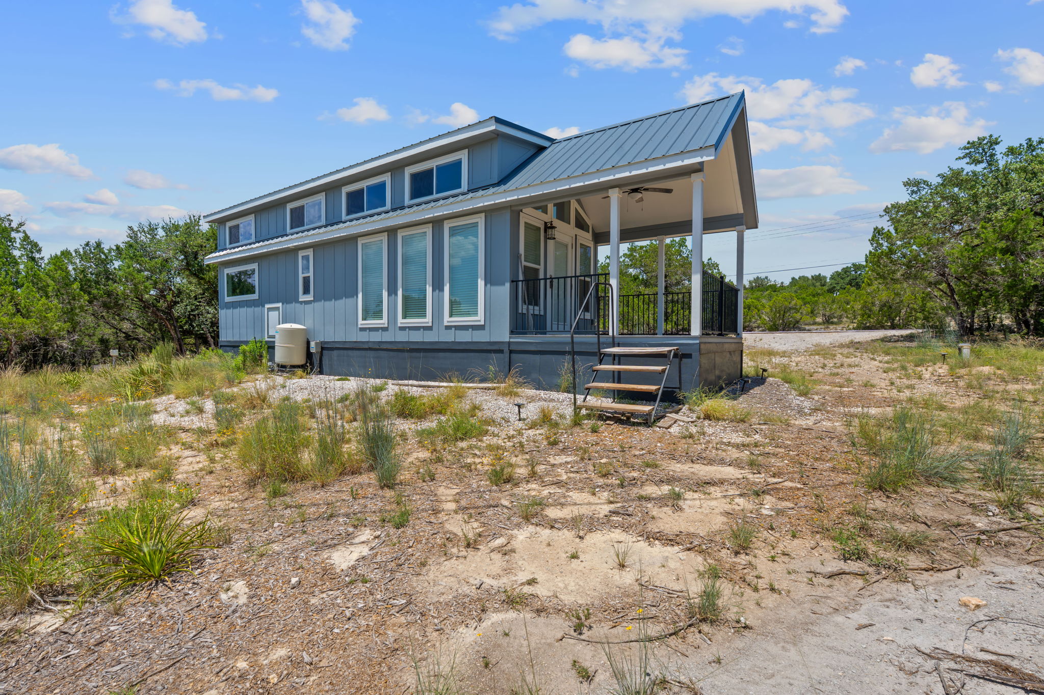 635 Ivean Pearson Road Lago Vista, TX 78645 - Photo 17 of 24 a front view of a house with garden