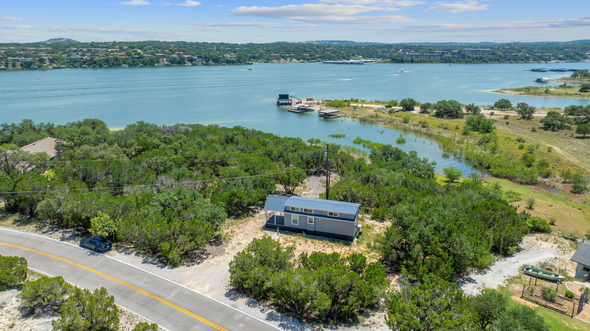 635 Ivean Pearson Road Lago Vista, TX 78645 - Photo 19 of 24 an aerial view of a residential houses with outdoor space and lake view