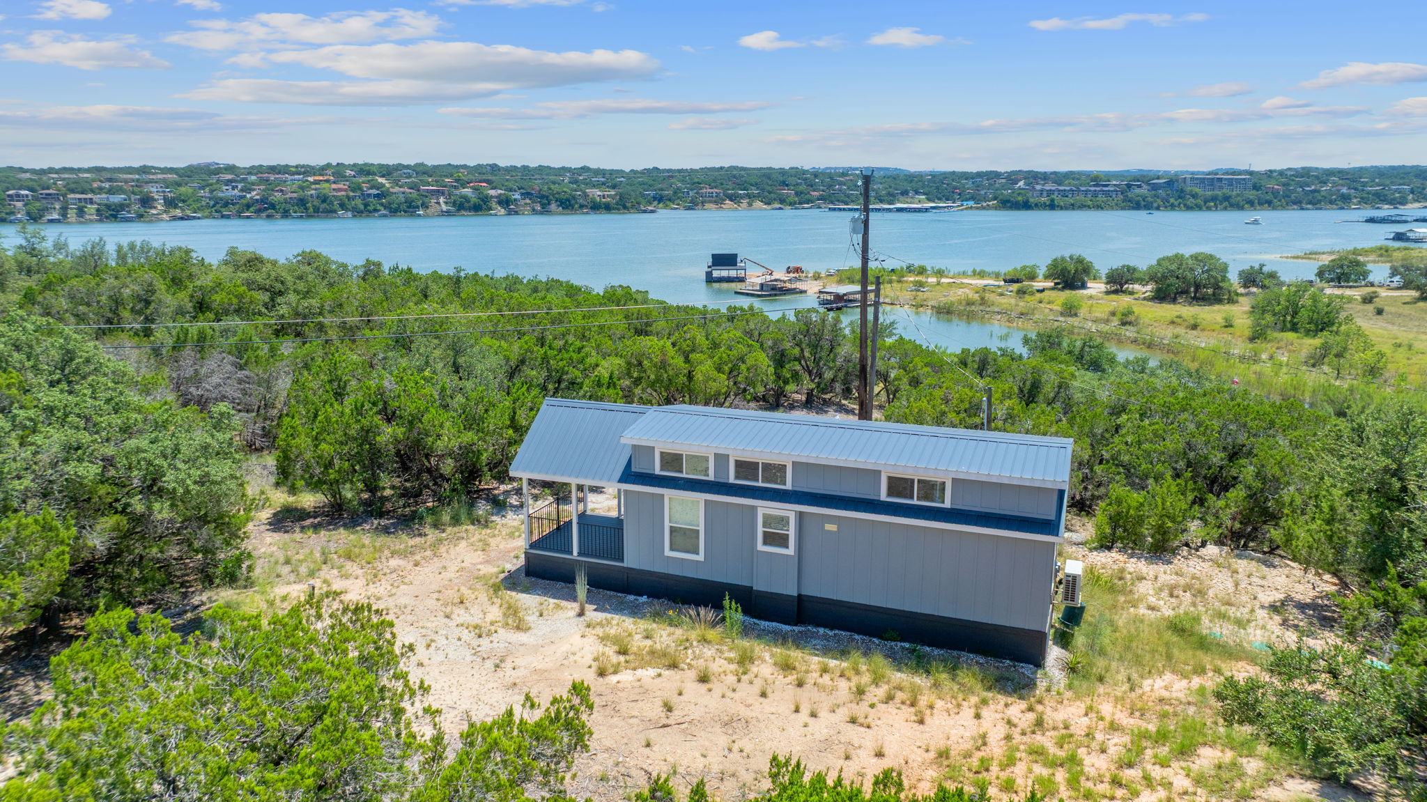 635 Ivean Pearson Road Lago Vista, TX 78645 - Photo 2 of 24 a view of a house with a yard and lake view