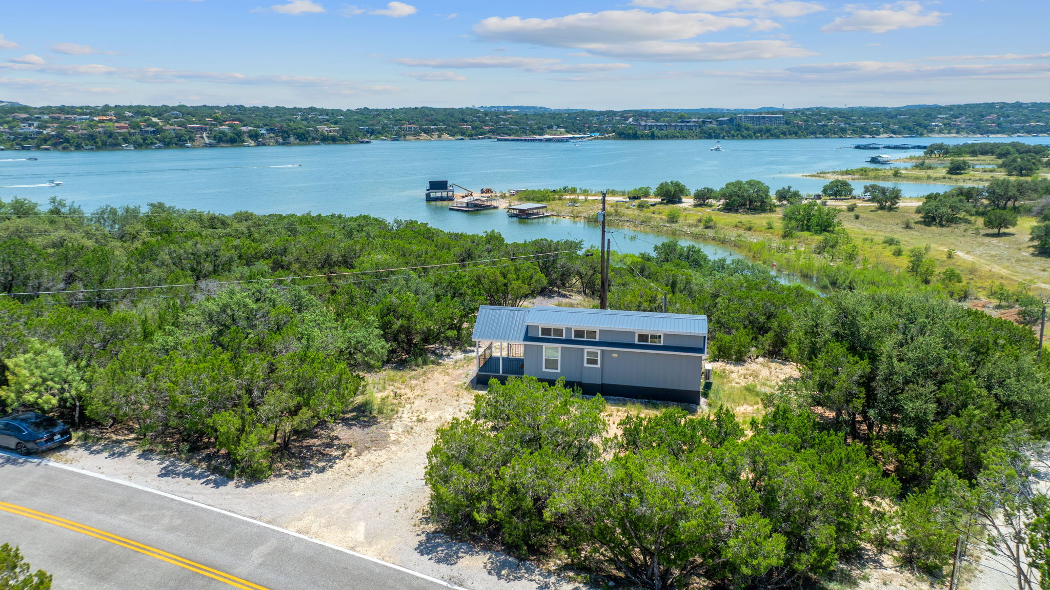 635 Ivean Pearson Road Lago Vista, TX 78645 - Photo 21 of 24 a view of a lake with houses in the back