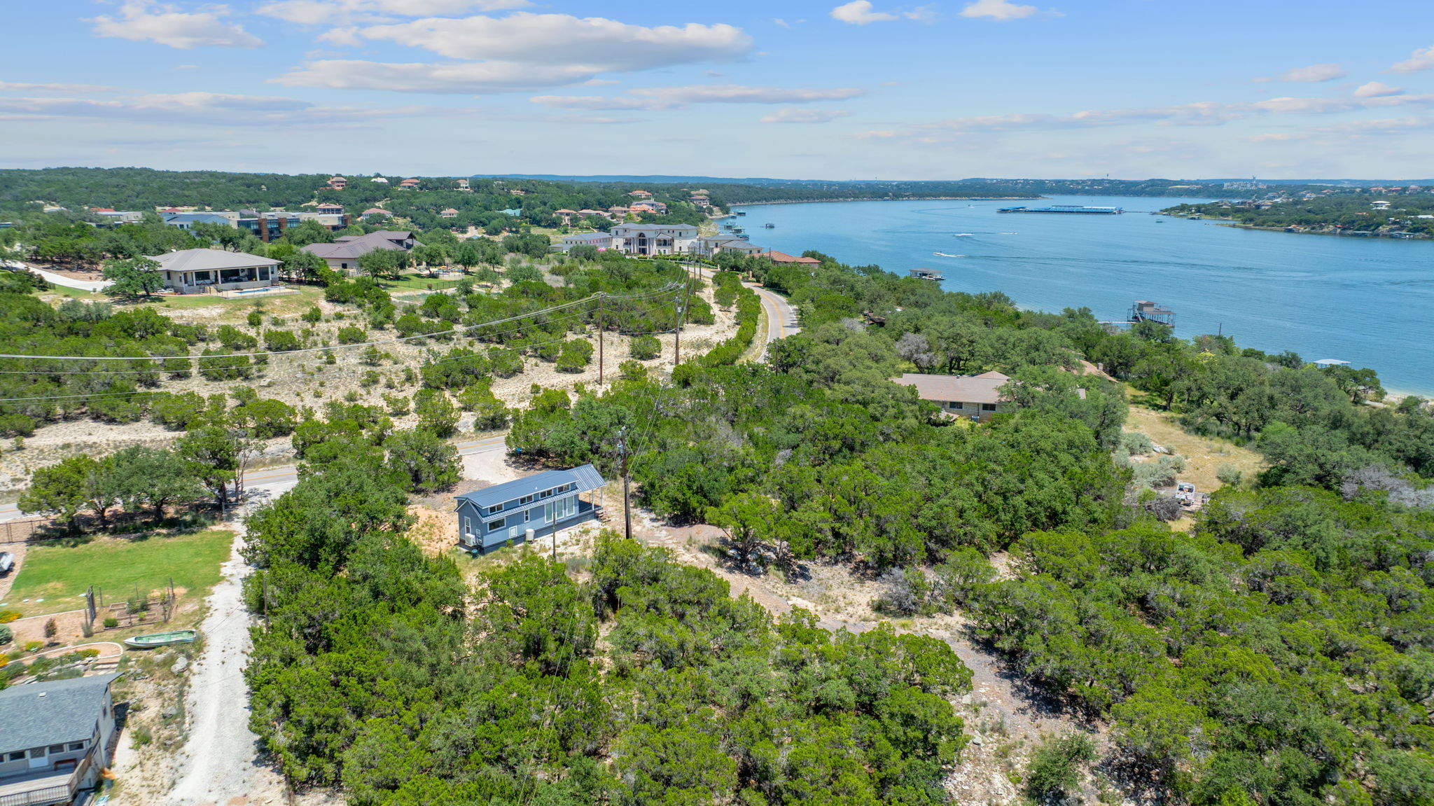 635 Ivean Pearson Road Lago Vista, TX 78645 - Photo 3 of 24 a view of a lake with a city