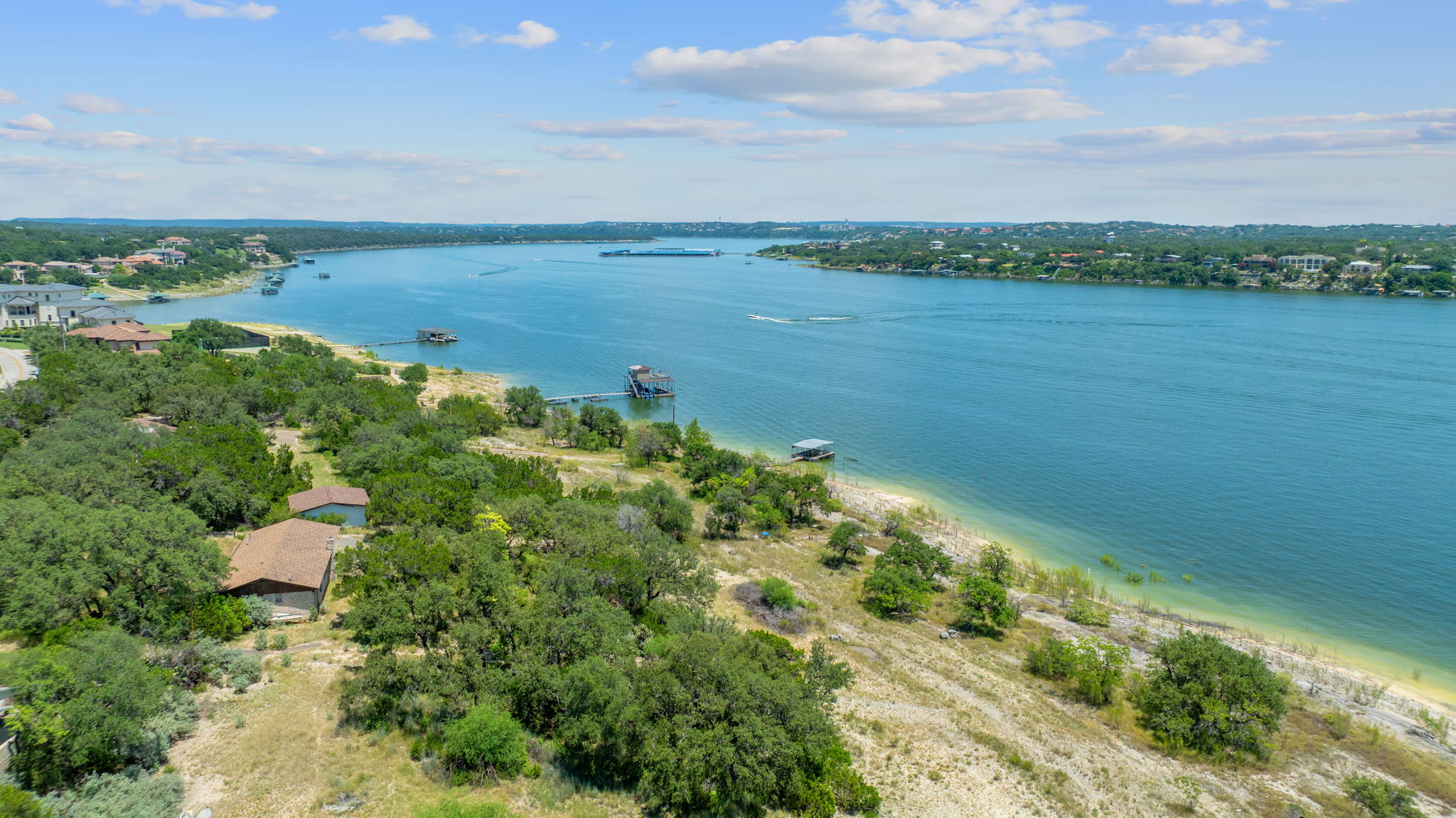 635 Ivean Pearson Road Lago Vista, TX 78645 - Photo 4 of 24 a view of a lake with a yard