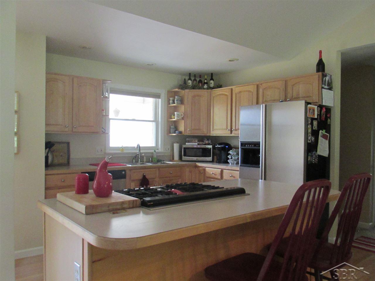 7965 Blackmar Road Birch Run, MI 48415 - Photo 12 of 12 Complete with appliances. Hardwood floor. Open floor plan.