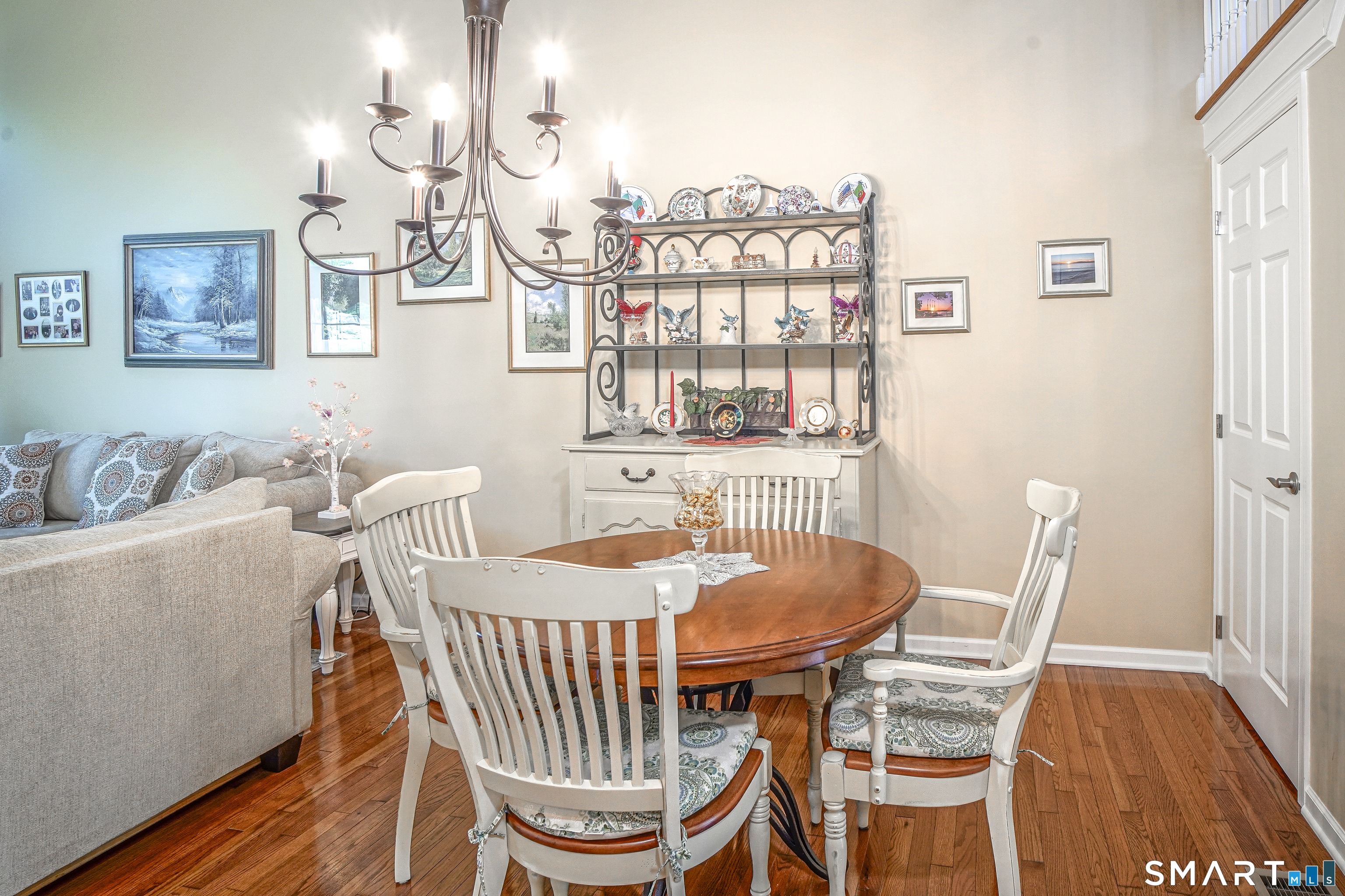 6 Lilac Lane, Unit 6 Prospect, CT 06712 - Photo 38 of 40 An open floor plan allows a spacious area for dining with custom lighting and hardwood floors