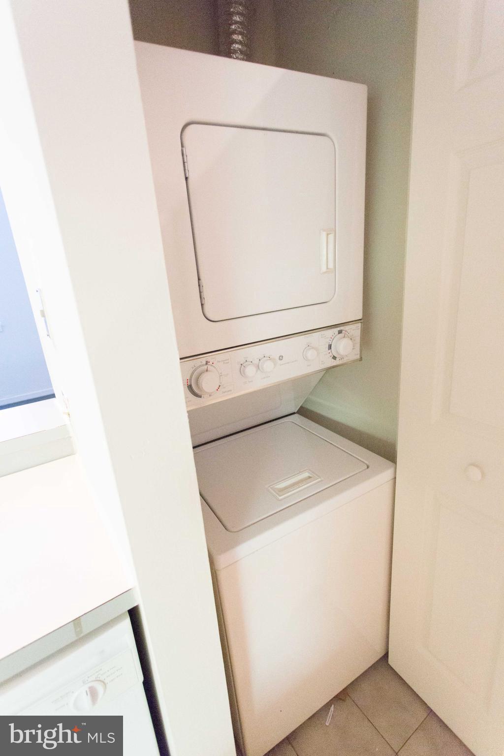130-8 Arch Street, Unit 207 Philadelphia, PA 19106 - Photo 14 of 23 a utility room with dryer and washer