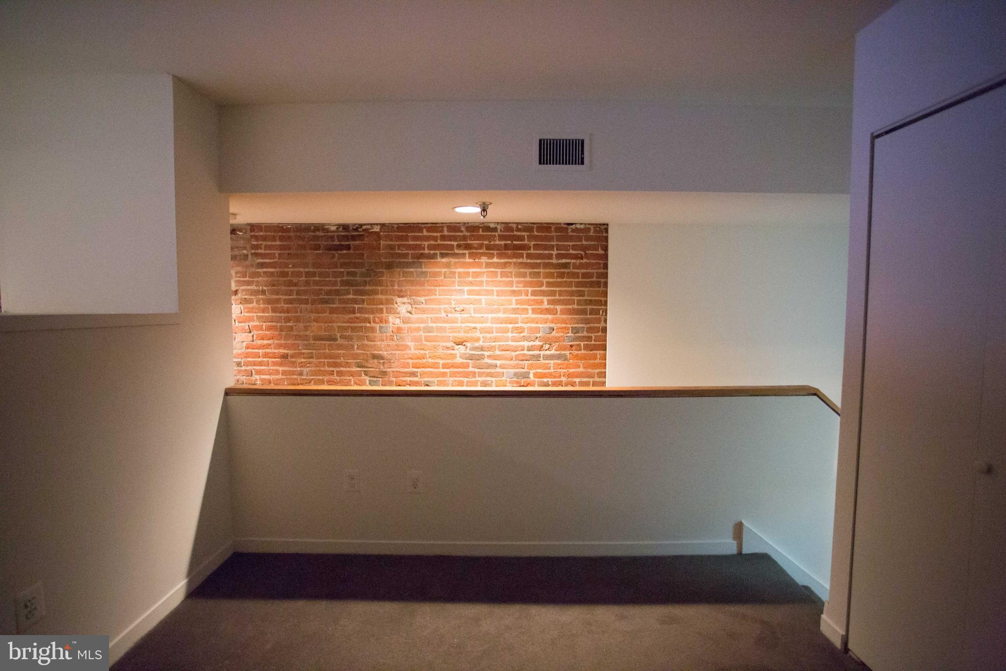 130-8 Arch Street, Unit 207 Philadelphia, PA 19106 - Photo 17 of 23 a view of an empty room with a window