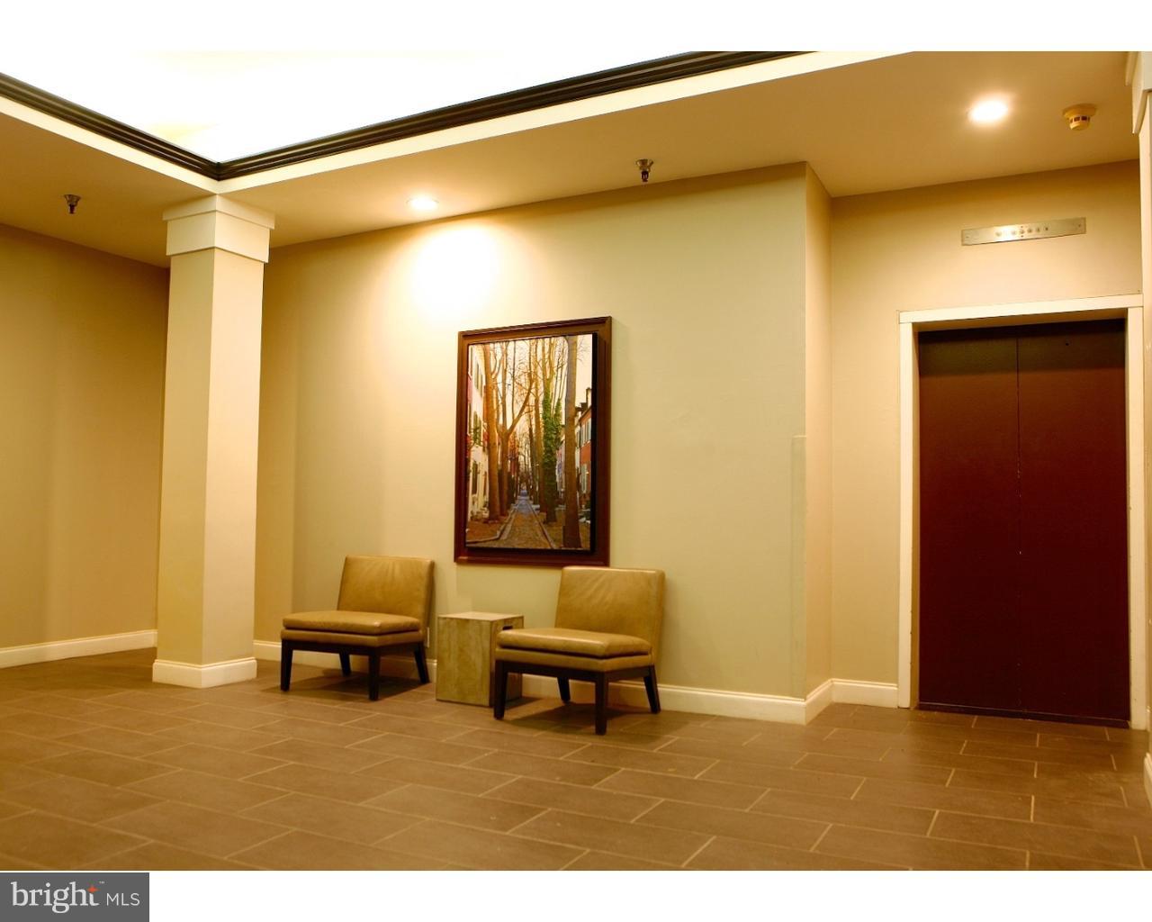 130-8 Arch Street, Unit 207 Philadelphia, PA 19106 - Photo 4 of 23 a living room with furniture