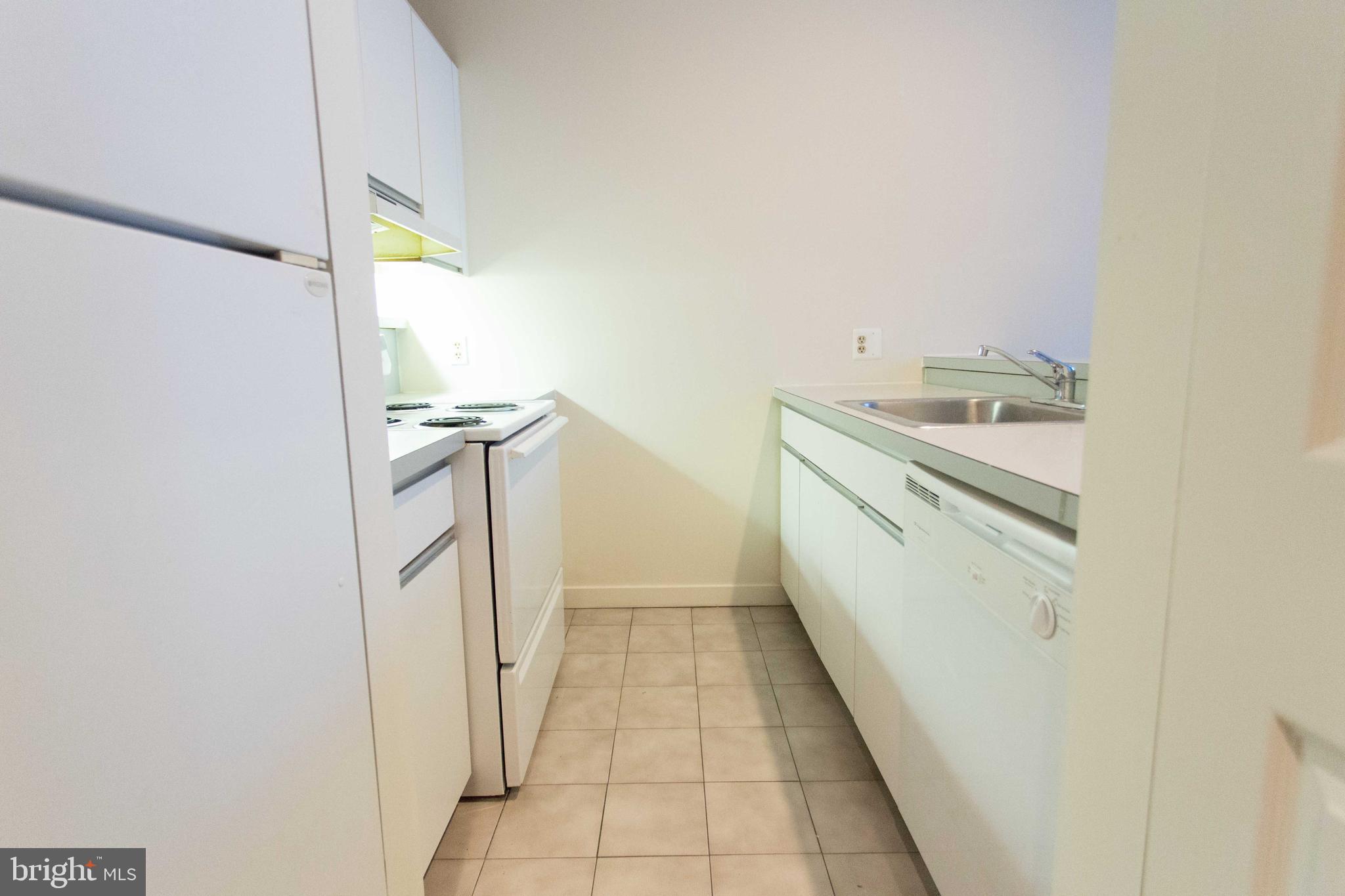 130-8 Arch Street, Unit 207 Philadelphia, PA 19106 - Photo 9 of 23 a bathroom with a sink and a mirror