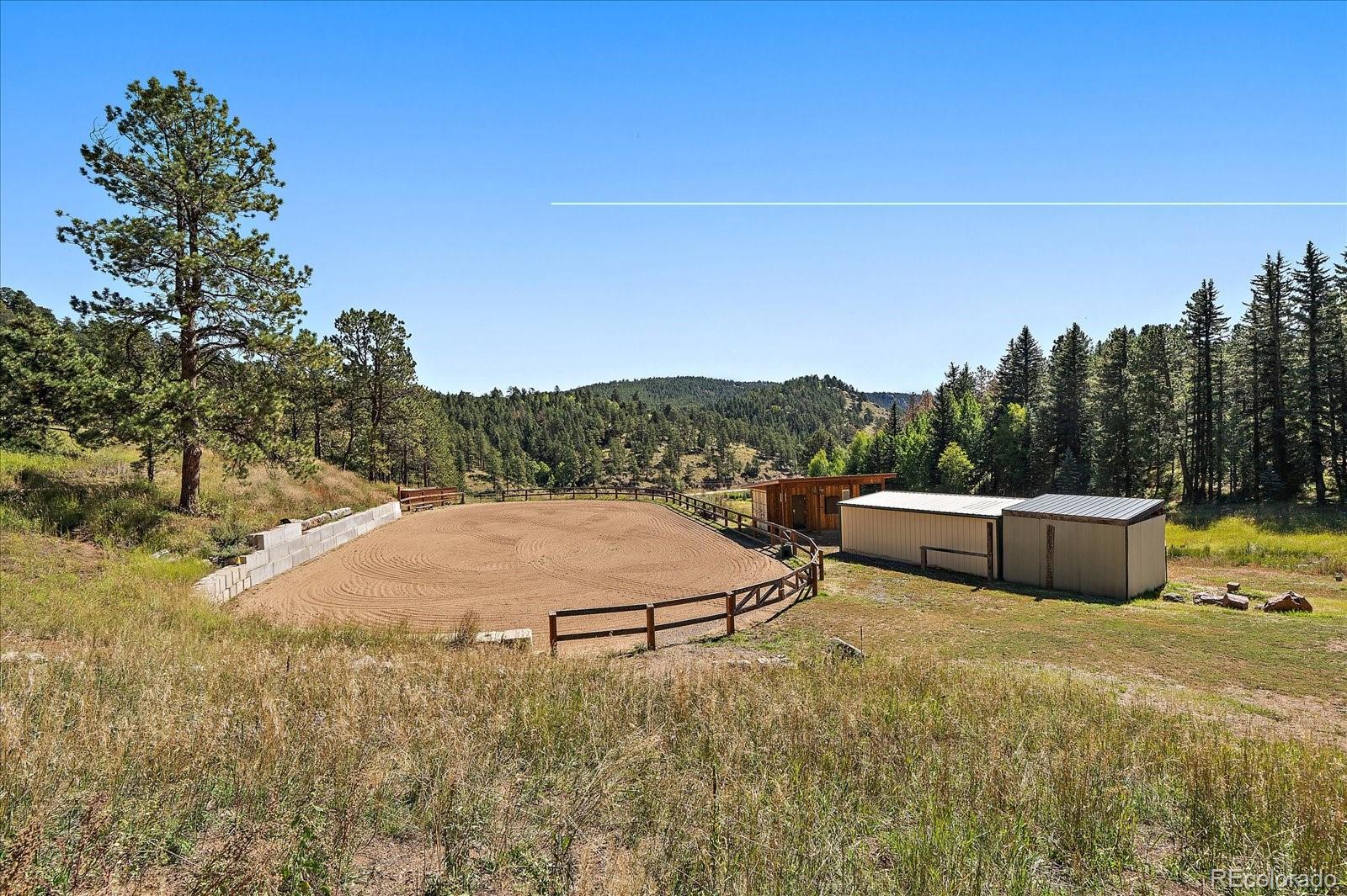 0 South Geronimo Trail Conifer, CO 80433 - Photo 19 of 34 a view of a house with a yard and sitting area