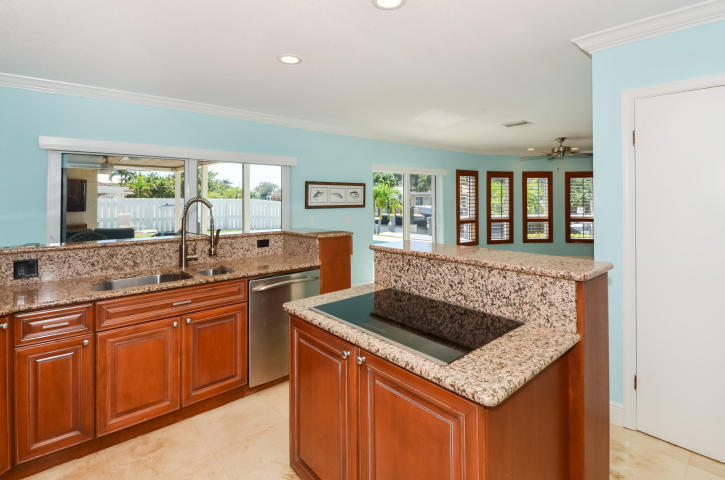 790 Forsyth Street Boca Raton, FL 33487 - Photo 8 of 27 a kitchen with stainless steel appliances granite countertop a sink stove and refrigerator