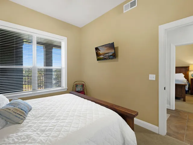 a bedroom with a bed and a tv