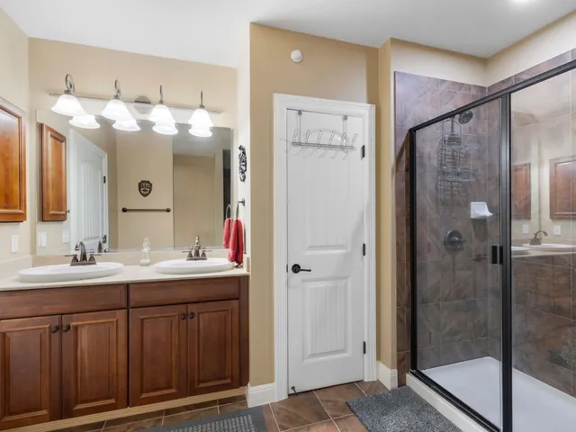 a bathroom with a sink vanity and a mirror