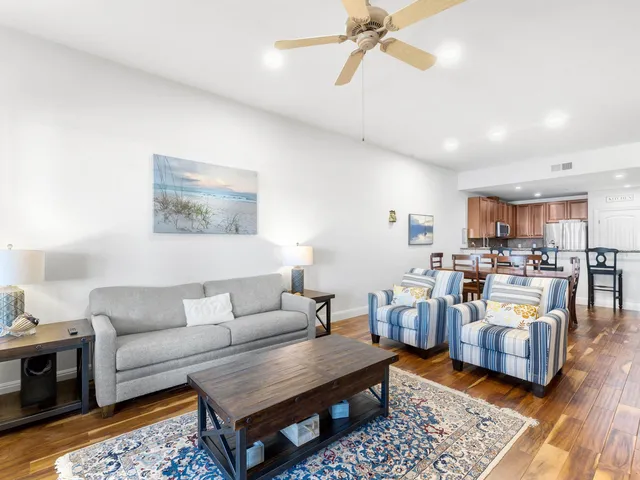 a living room with furniture and a rug