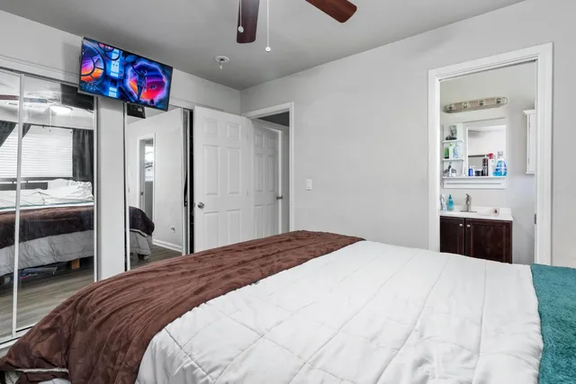 a bedroom with a bed and a dresser