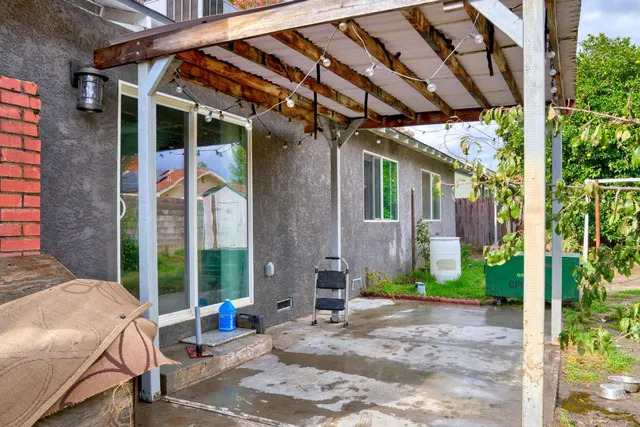 a view of yard with patio