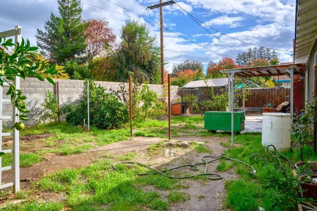 a view of a chair and tables in the garden