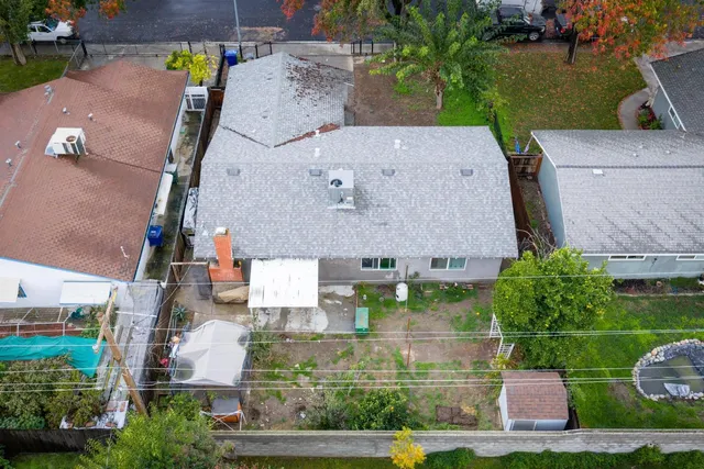an aerial view of multiple houses with outdoor space