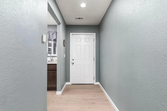 an empty room with entrance door