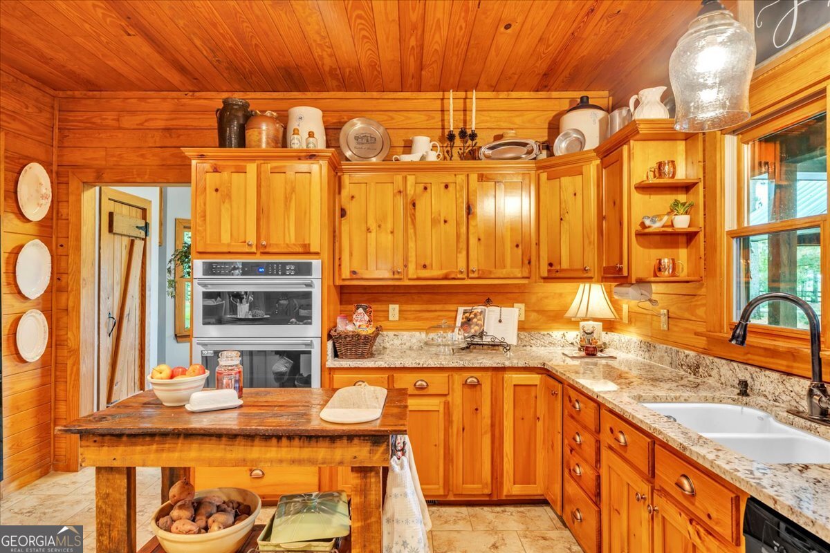 568 Hopewell Church Road Rhine, GA 31077 - Photo 13 of 77 a bathroom with a granite countertop sink and a bathtub