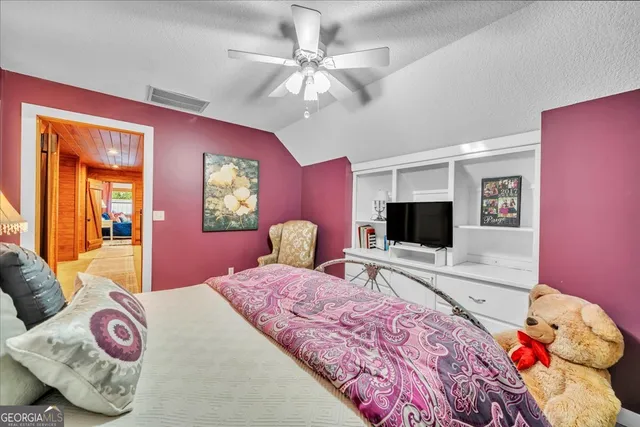 a view of a patio with table and chairs
